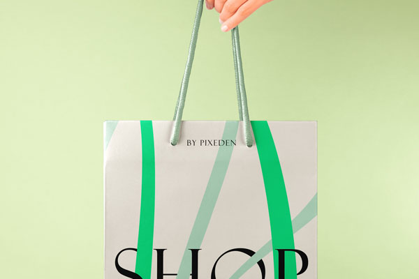 Hand Holding Paper Bag Mockup in Close-up Sight