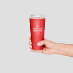 Hand Holding Paper Coffee Cup Mockup