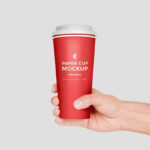 Hand Holding Paper Coffee Cup Mockup