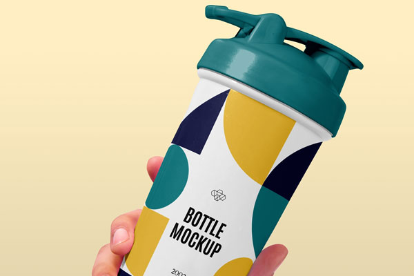 Hand Holding Sport Bottle Mockup