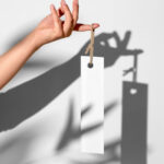 Hand Holding Vertical Label Mockup