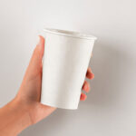Hands Holding Paper Hot Cup Mockup in Front View