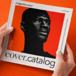 Hands Holding Square Catalog Mockup in Perspective View