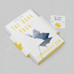 Hardcover Book With Torn Special Wrapping Plus a Tag Mockup