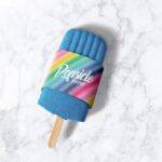 Ice Popsicle in Packaging Sleeve Laid in the Top View Mockup