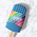 Ice Popsicle in Packaging Sleeve Laid in the Top View Mockup