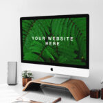 iMac on Wooden Stand on a Desk Mockup