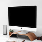 iMac on Wooden Stand on a Desk Mockup