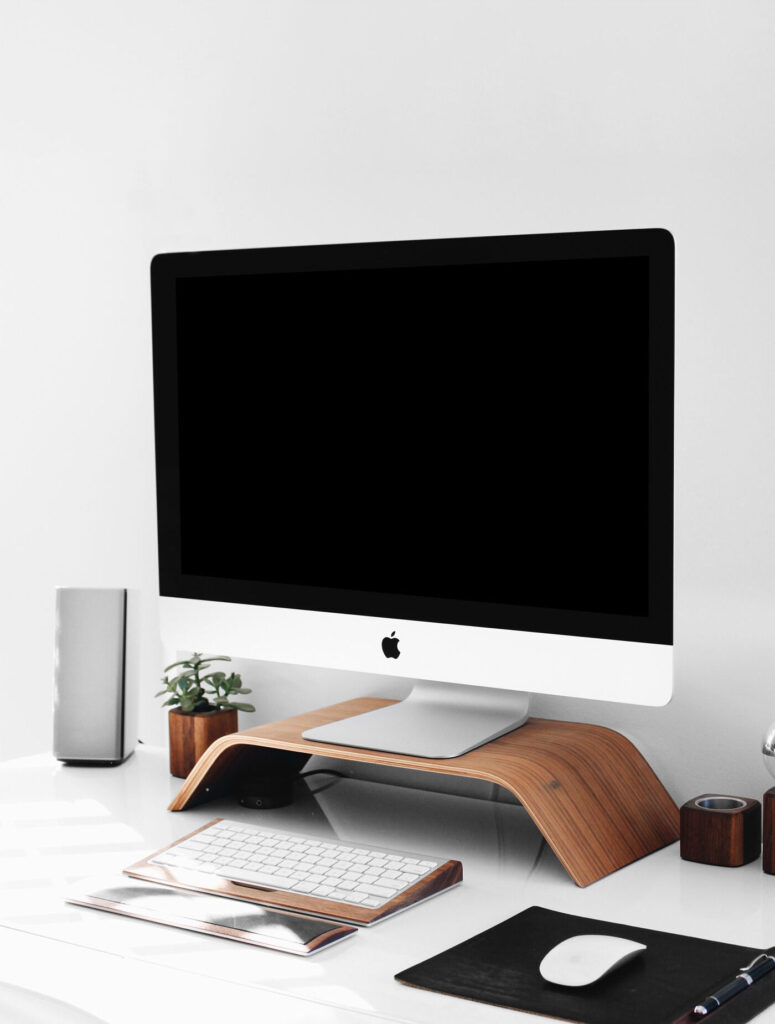 iMac on Wooden Stand on a Desk Mockup