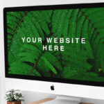 iMac on Wooden Stand on a Desk Mockup