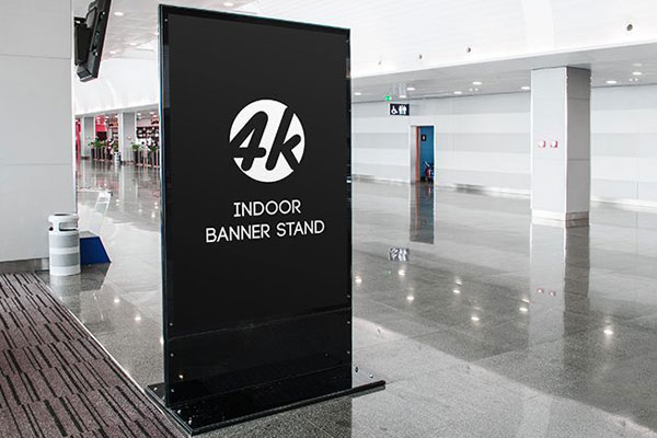 Indoors, Vertical Banner Stand in the Half-Side View Mockup