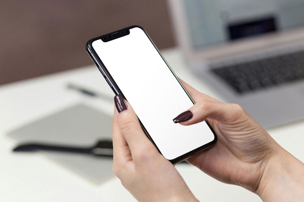 iPhone in Woman Hands Mockup