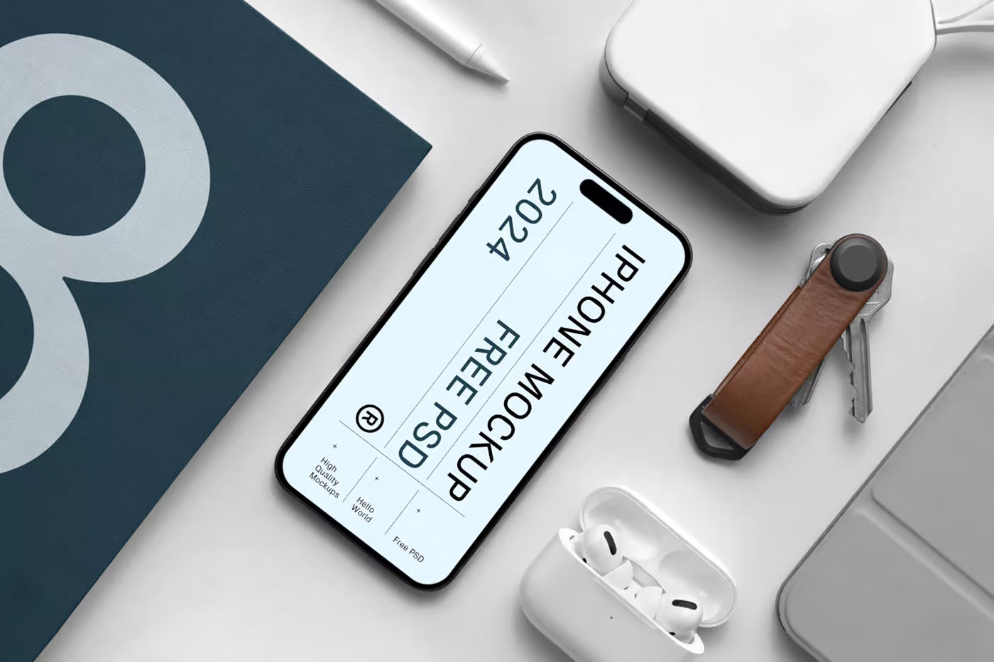Free iPhone Pro with Book Mockup PSD Template