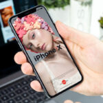 iPhone X Grabbed by Hand in Perspective Mockup