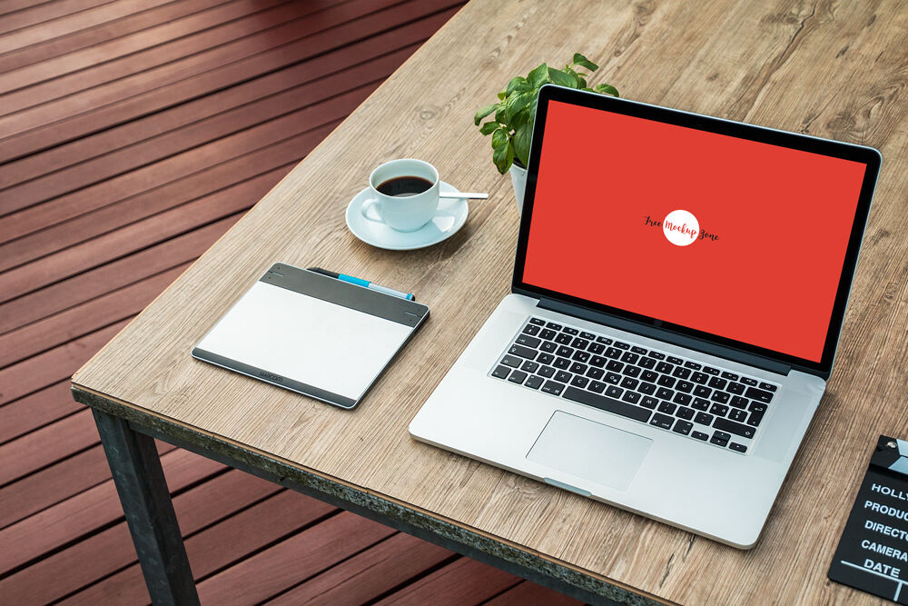 Laptop Mockup on Wooden Desk Outdoor at a 34 Angle View