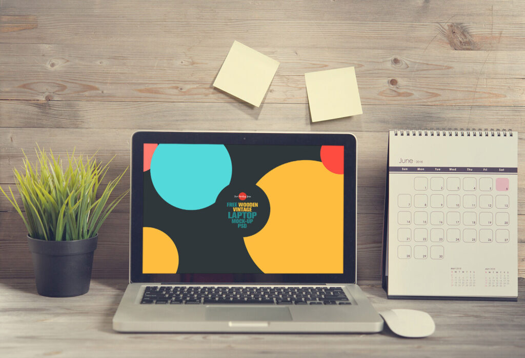 Laptop Opened on a Wooden Desk in Front View Mockup