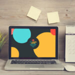 Laptop Opened on a Wooden Desk in Front View Mockup