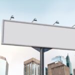 Low-angle Shot Horizontal Billboard Mockup Featuring City Buildings