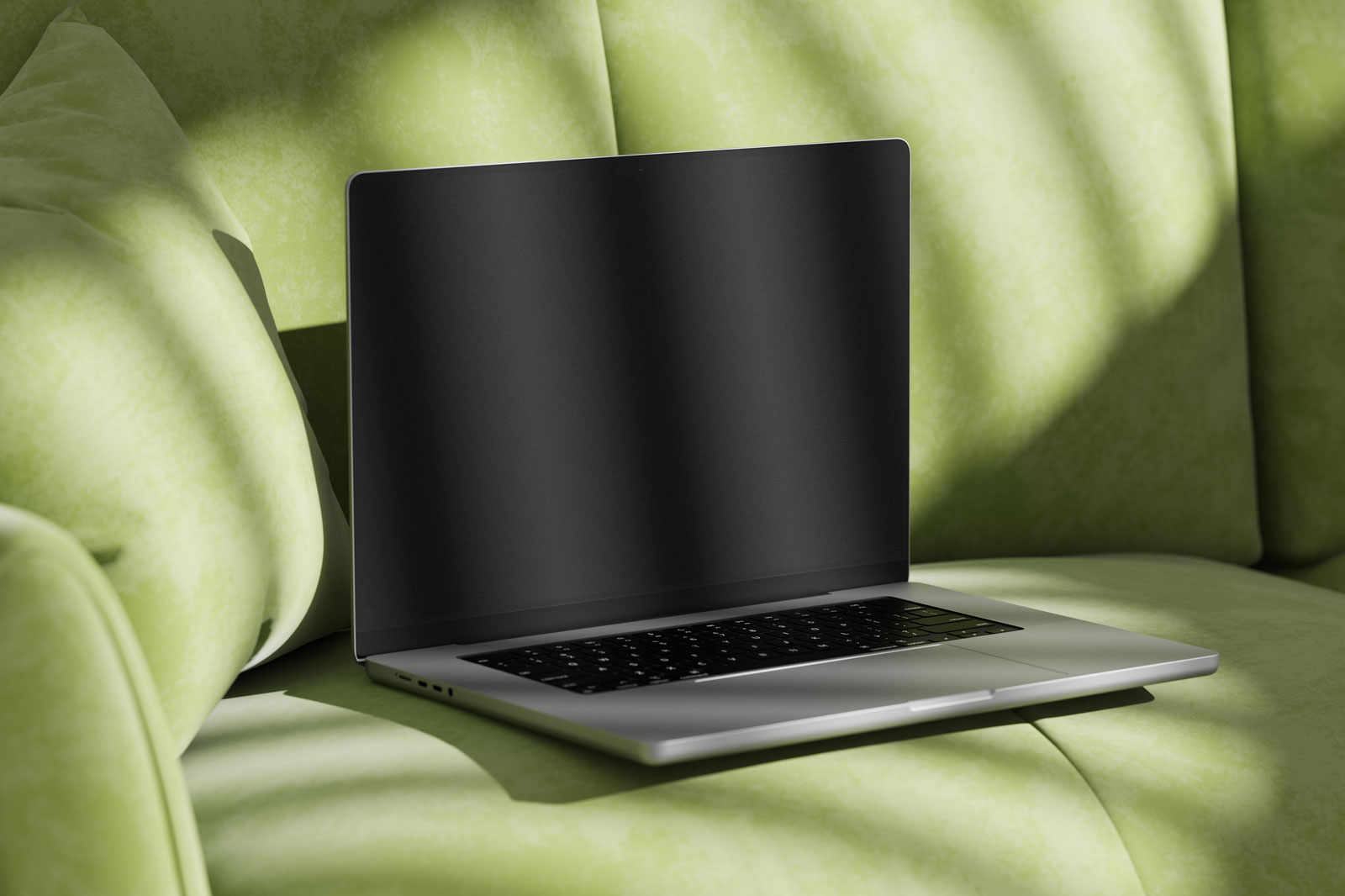 Free MacBook Pro Mockup on Sofa PSD Template