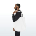 Men Holding Big Canvas Bag Mockup