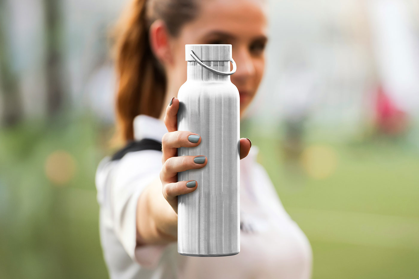 Free Metal Water Bottle in Hand Mockup PSD Template