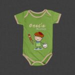 Minimalistic Top View Baby Onesie Flat Laid on Floor Mockup