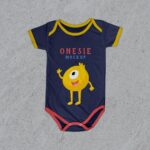 Minimalistic Top View Baby Onesie Flat Laid on Floor Mockup