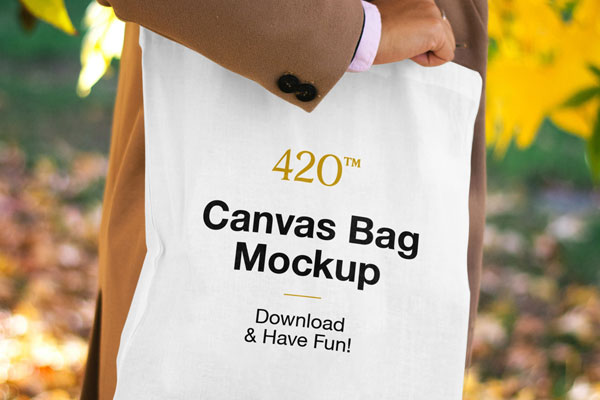 Mockup Features a Woman Holding the Canvas Bag