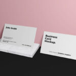 Mockup Featuring 2 Business Cards Relying on Wall