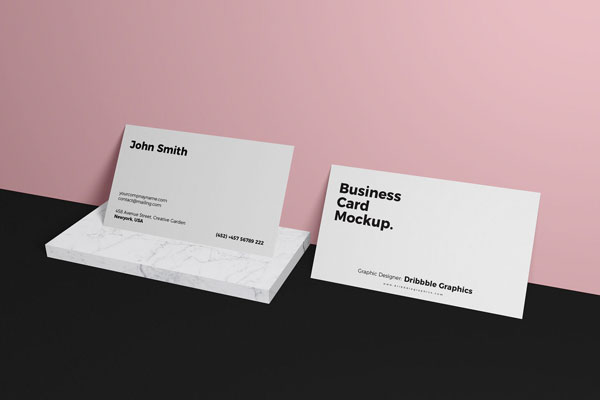 Mockup Featuring 2 Business Cards Relying on Wall