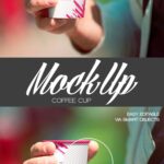 Mockup Featuring a Hand Holding a Disposable Hot Cup