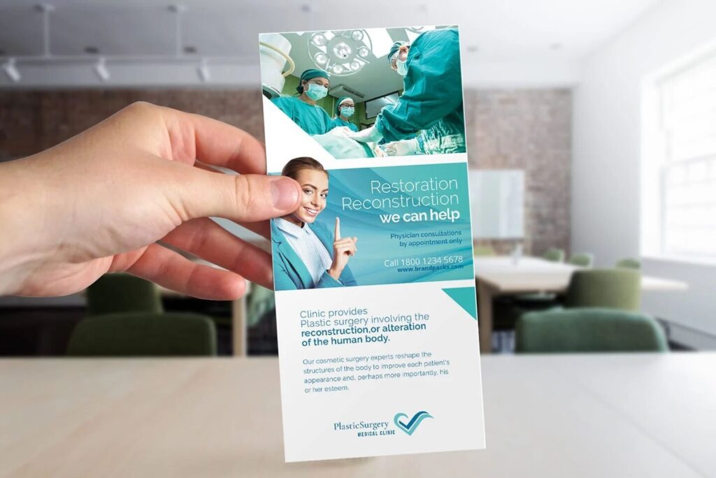 Mockup Featuring a Hand Holding a DL Rack Card