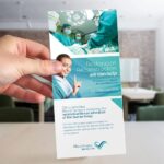 Mockup Featuring a Hand Holding a DL Rack Card