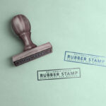 Mockup Featuring a Rectangle Rubber Stamp With Two Stamp Marks