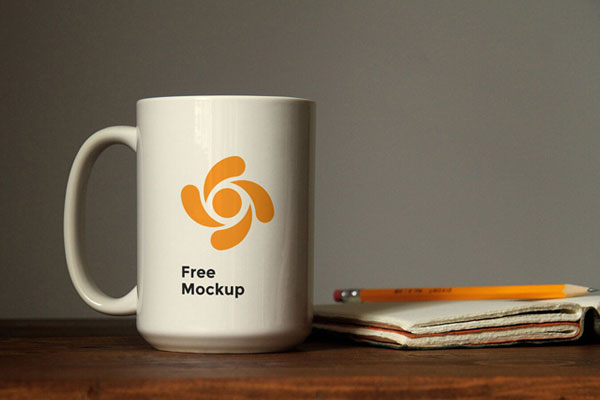 Mockup Featuring Front View of a Coffee Mug on a Wooden Table