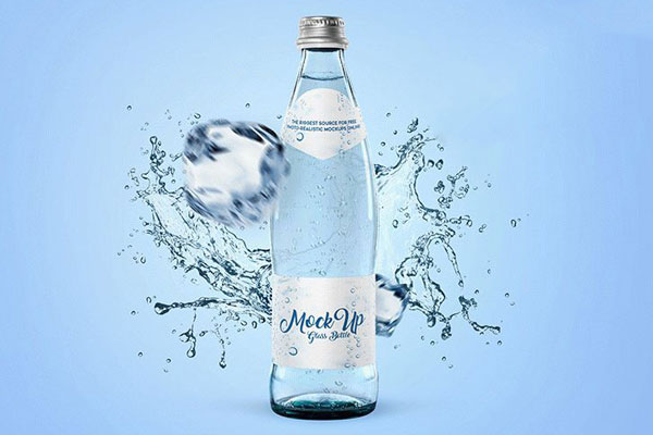 Mockup Featuring Glass Bottled Water, with Water Splash in the Background