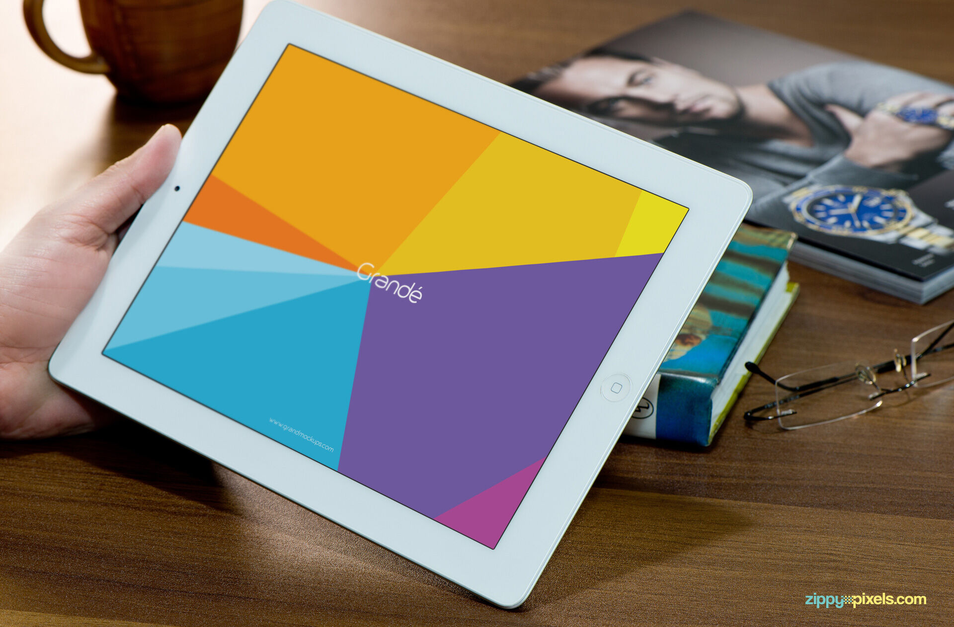Mockup Featuring Hand Holding iPad on Wooden Table FREE PSD