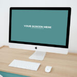 Mockup Featuring iMac on Wooden Desk in Perspective
