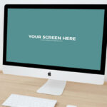 Mockup Featuring iMac on Wooden Desk in Perspective