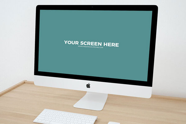 Mockup Featuring iMac on Wooden Desk in Perspective