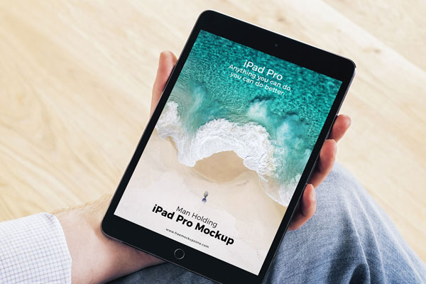 Mockup Featuring iPad Pro Grabbed by Hand with a 3\4 Angle View