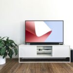 Mockup Featuring TV on a Desk in Indoor Setting