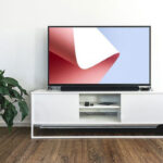Mockup Featuring TV on a Desk in Indoor Setting