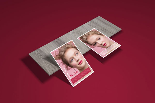 Mockup Featuring Two Flyers and a Slab of Wood at the 3\4 Angle View