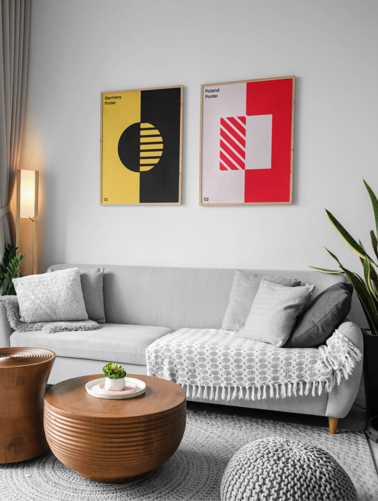 Mockup Featuring Two Posters Hanging Above Couch in Living Room