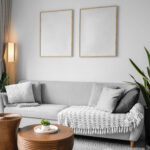 Mockup Featuring Two Posters Hanging Above Couch in Living Room