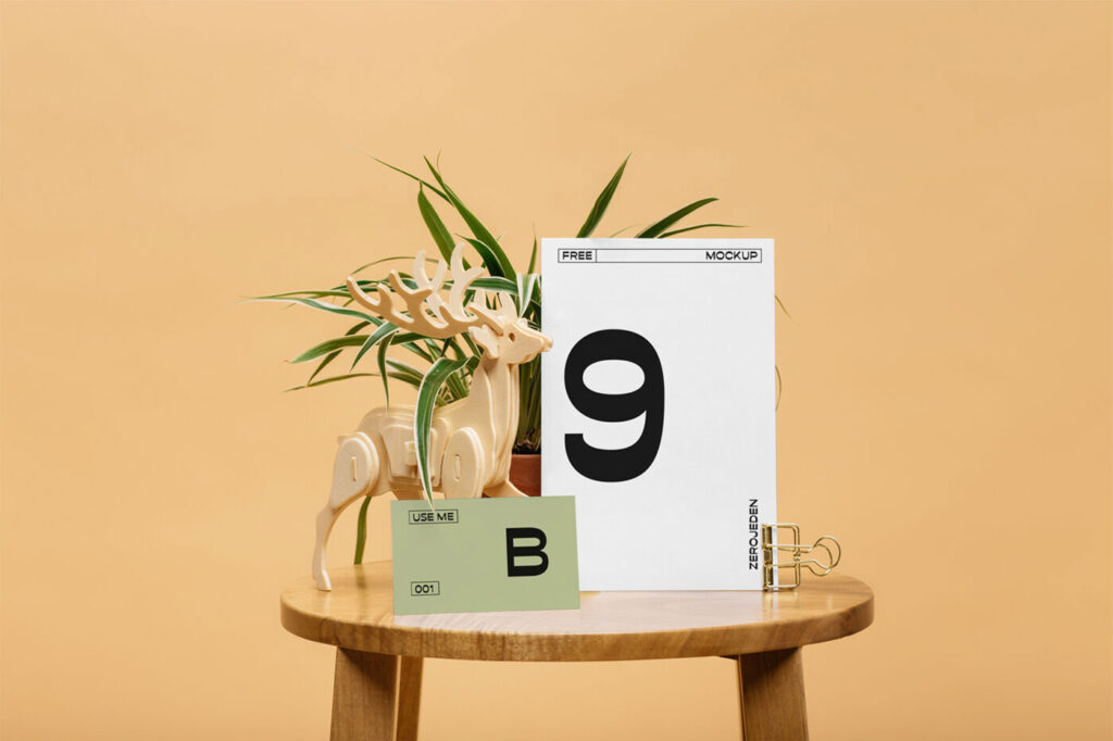 Mockup Featuring Two Sized Cards on Wooden Round Table