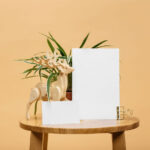Mockup Featuring Two Sized Cards on Wooden Round Table