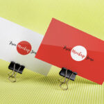 Mockup of 2 Business Cards Held by Binder Clips