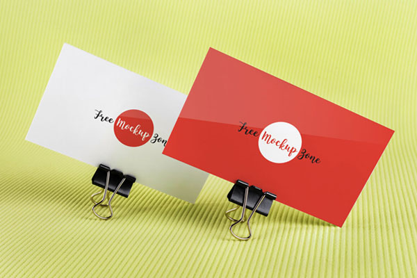 Mockup of 2 Business Cards Held by Binder Clips